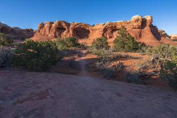 hiking the broken arch trail to tapestry arch in arches national park, utah, usa