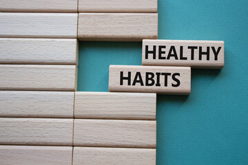 Healthy habits symbol. Concept word Healthy habits on wooden blocks. Beautiful grey green background. Business and Healthy habits concept. Copy space