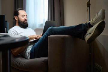 Middle-aged male spends the evening in online communication