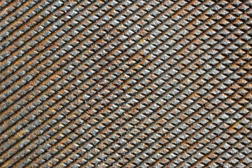 Grunge rusty metal background of file or rasp texture, closeup, top view