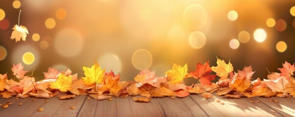 Naklejka na ściany i meble Fallen leaves in autumn month isolated on light orange background.