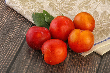 Red juicy raw plum heap