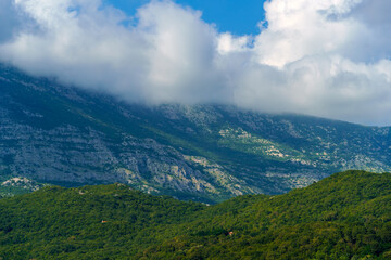 beautiful mountains and cloudy sky, summer landscape, clouds, forest on the hillsides