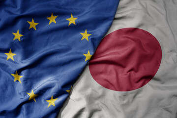 big waving realistic national colorful flag of european union and national flag of japan . - obrazy, fototapety, plakaty