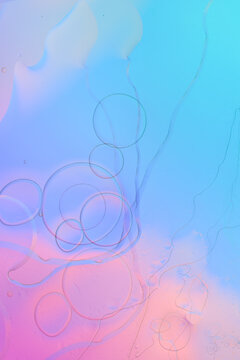 Iridescent colorful abstract background with bubbles, fluid texture pastel tones curvy wavy good vibes