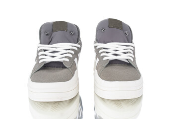 Pair modern sport sneakers close up isolated on white background