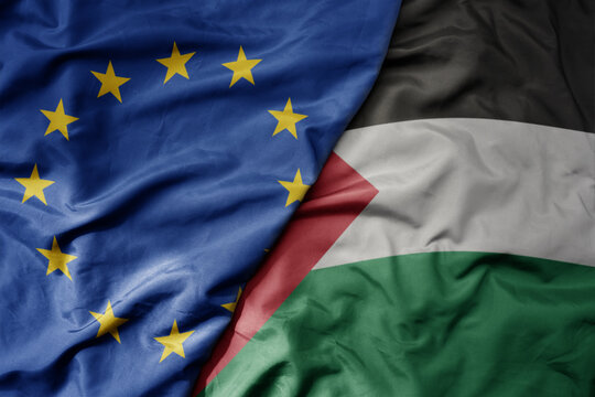 big waving realistic national colorful flag of european union and national flag of palestine .