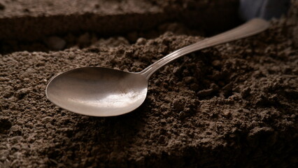 a dirty and faded spoon