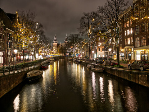 Amsterdam architecture and canal views in city lights during Christmas. Amsterdam, Netherlands © Konstantinos