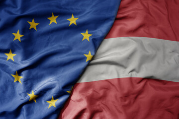 big waving realistic national colorful flag of european union and national flag of austria .