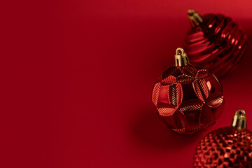 Christmas card with red Christmas balls on a red background