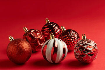 closeup of christmas balls on a red background