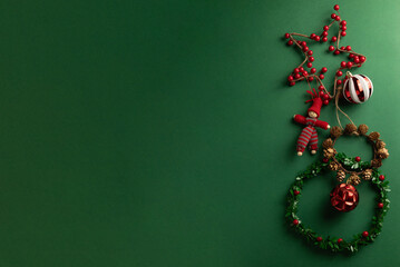 Beautiful Christmas ornaments on a green background