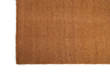 Fototapeta na wymiar Natural brown coconut fiber doormat. Plain natural dry carpet and dirt outside your entrance, Detail, closeup of fiber and base on white background.
