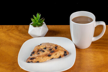 blueberry scone  with a cup of coffee