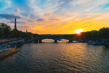 Fototapeta na wymiar Lantern in silhouette with beautiful colorful sunset and seine river. Paris, France. 