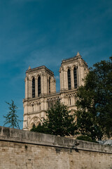Fototapeta na wymiar Paris, France. April 22, 2022: Notre Dame Cathedral with blue sky in the city.