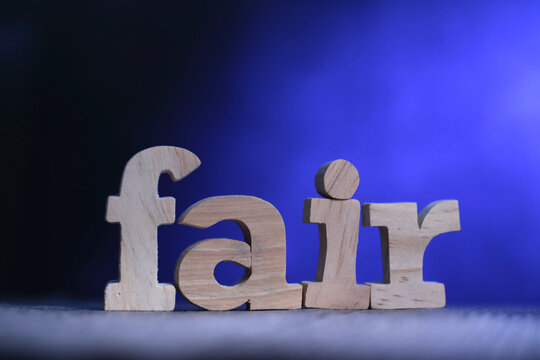 Fair, text words typography written on wooden lettering, life and business motivational inspirational