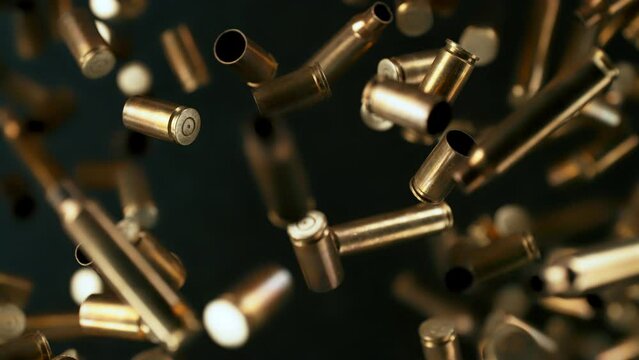 Super Slow Motion Shot of Used Real Gun Bullets Flying Towards Camera at 1000fps.
