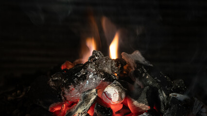 Burning coals for barbecue. A stove prepared for barbecue with flames, 