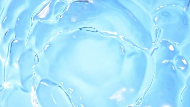 Super Slow Motion Shot of Waving Light Blue Liquid Surface at 1000fps.