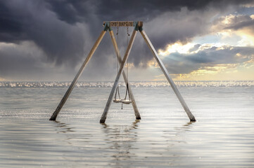 Swing set under water