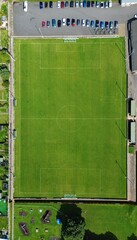 Top down expanding shot of football pitch - small football ground 