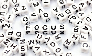Selective focus. The word FOCUS in the center of the image