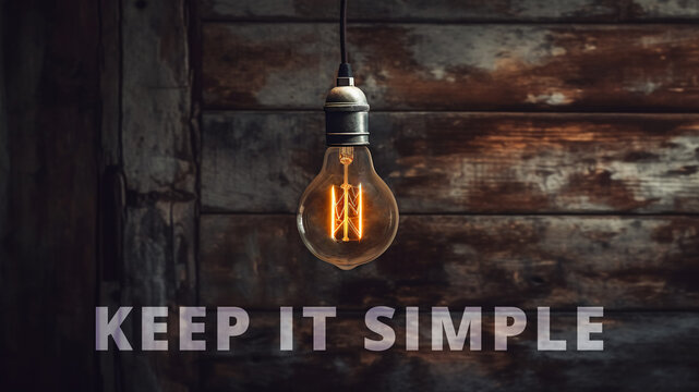 Illustration of a retro light bulb in front of a rustic background with text "keep it simple" on it