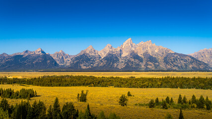 Blue sky over the majestic mountain peaks of Grand Teton National Park, Wyoming, USA
