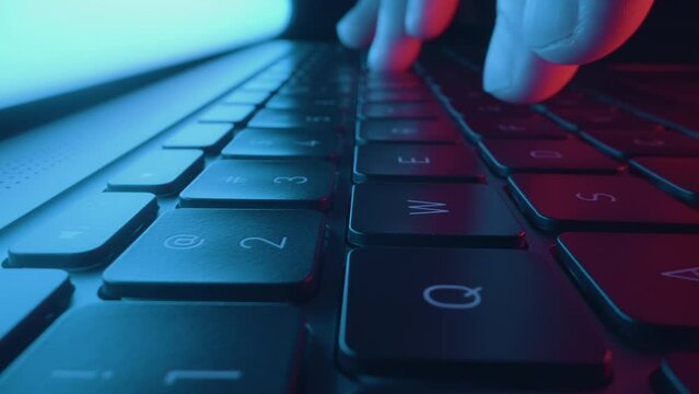 Close up of hands typing and coding on laptop keyboard. Digital innovation protection technology. Futuristic network server background. Blockchain crypto developer and binary program code concept