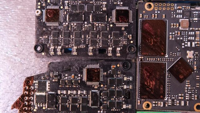Microchip and microprocessors, top view, rotate background. Computer PC chip close up. Computer motherboard components.