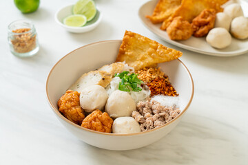 spicy small flat rice noodles with fish balls and shrimp balls without soup