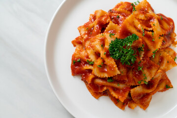 farfalle pasta in tomato sauce with parsley
