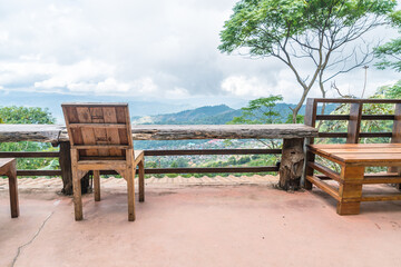 wood bar and chair with mountain hill background
