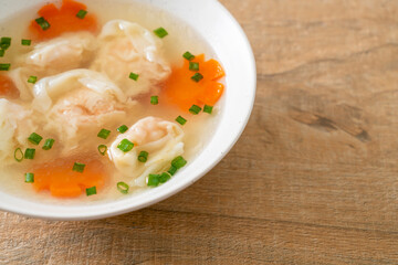 shrimp dumpling soup in white bowl