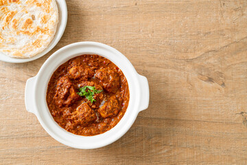 chicken tikka masala spicy curry meat food with roti or naan bread