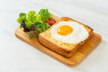 bread toasted with cheese and fried egg