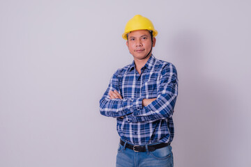 Asian engineer in striped shirt on white background