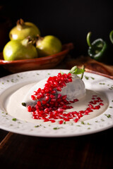 Chile en Nogada, Typical dish from Mexico. Prepared with poblano chili stuffed with meat and fruits and covered with a walnut sauce. Named as the quintessential Mexican dish for national holidays.