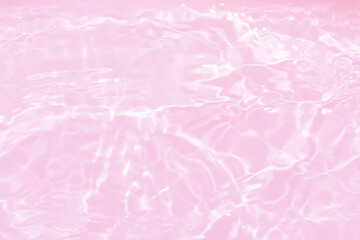 Pink water with ripples on the surface. Defocus blurred transparent pink colored clear calm water...