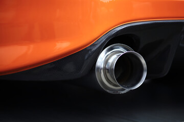 Orange tuned sports luxury car fragment. Sport car at the start.