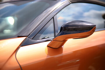 Orange tuned sports luxury car fragment. Sport car at the start.