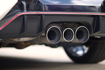 Close up of a car dual exhaust pipe