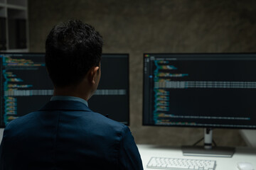 IT programmer working on desktop computer Male expert innovating software engineer app development program check coding in bugging system.
