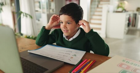 Boy, education and laptop with wave, video call and excited for online course, assessment and documents in home. Male child, computer and webinar for elearning, study or scholarship in family house