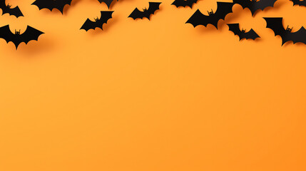 Halloween background with black paper bats flying on orange background. Space for text.