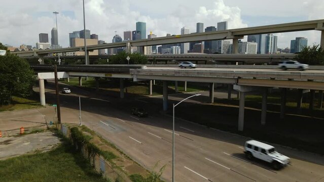 Aerial Rising From Houston Texas Street Up And Over Interstate Overpass