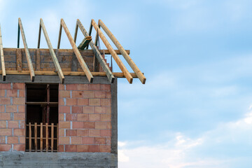 Construction site of terraced house or row homes. Roof truss wooden framework.