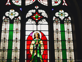 Fototapeta na wymiar Digital photo of a Gothic medieval stained glass window in a Catholic church.